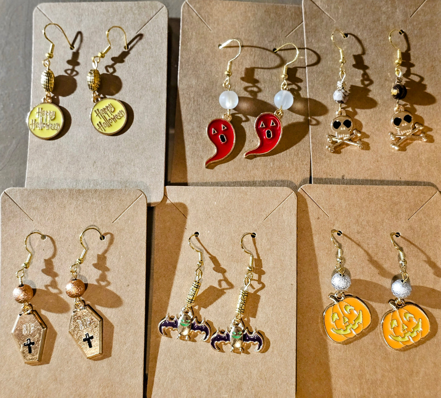 Halloween-themed earrings crafted on gold plated earring facets.