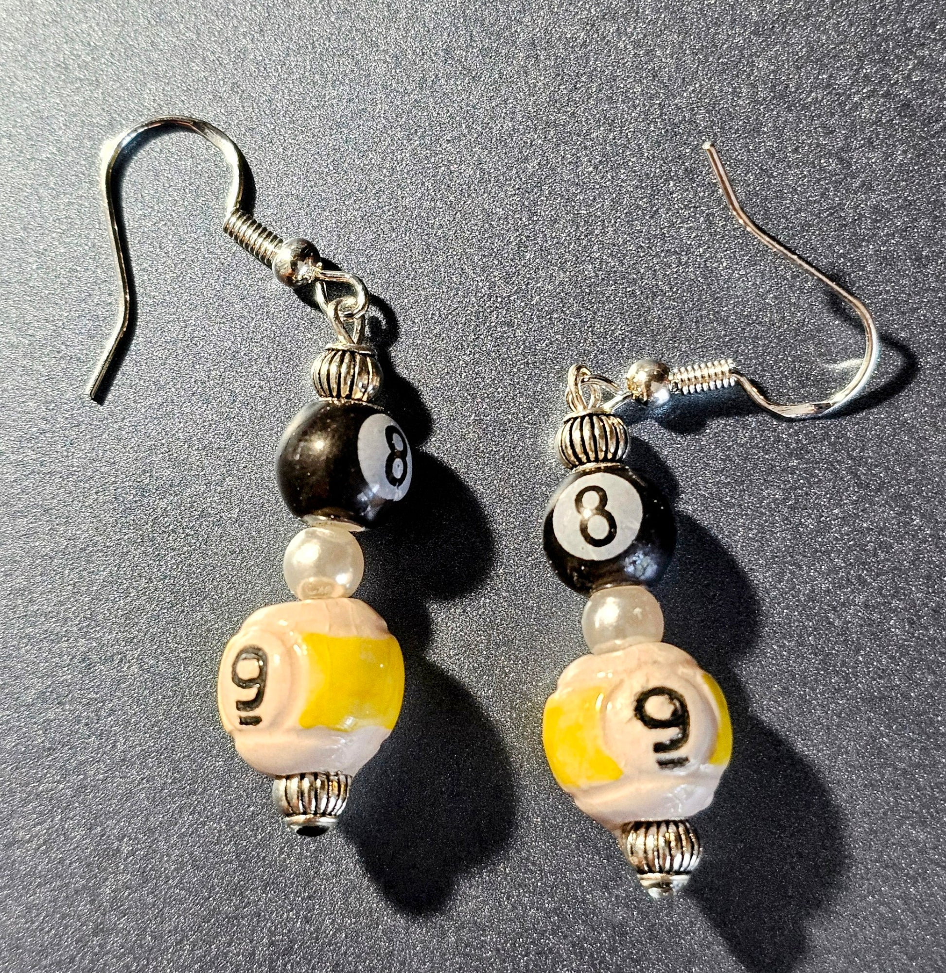 Handmade sterling silver earrings with "8" and "9" ball Double Jeopardy billiard ball beads.