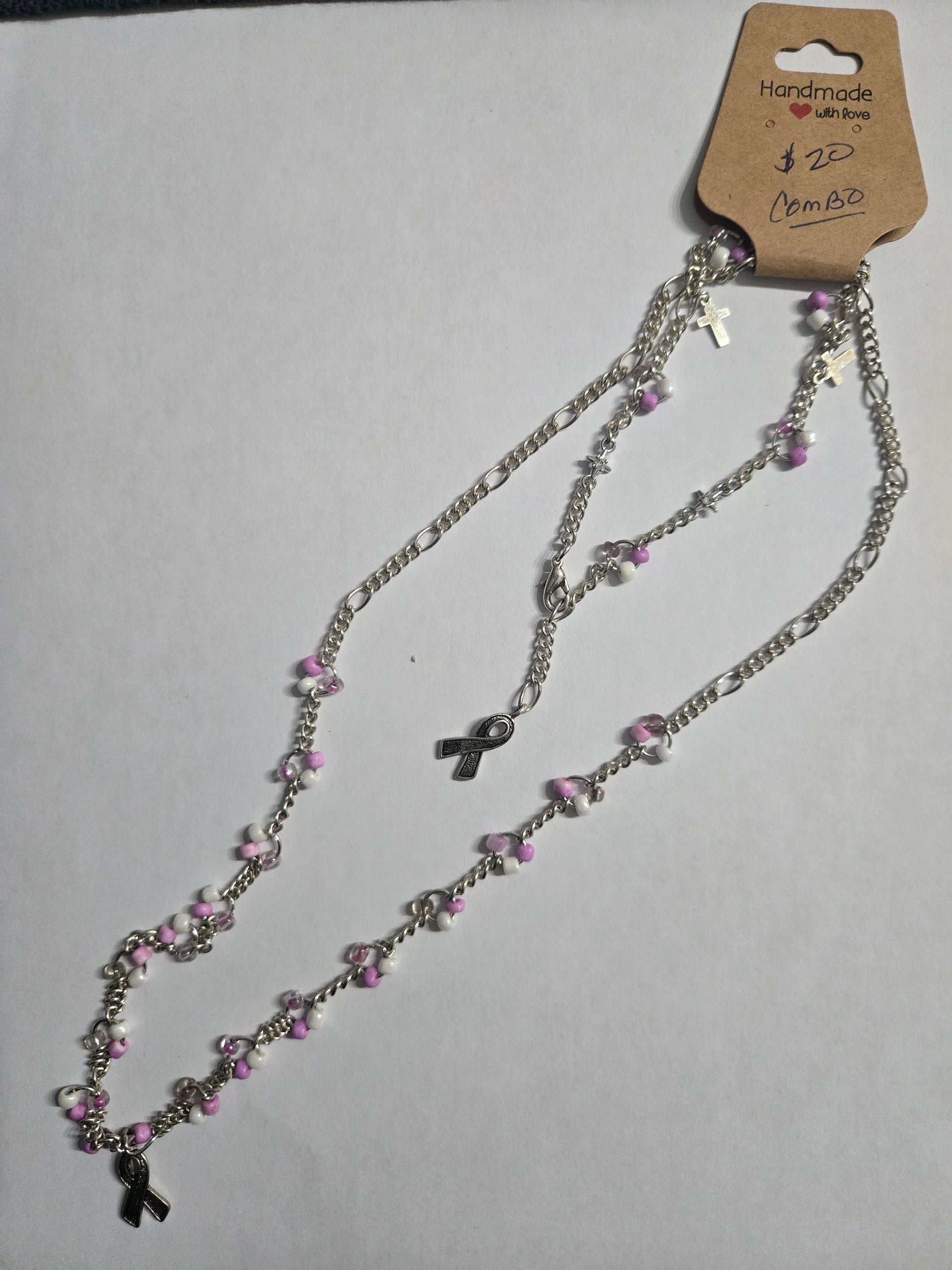 Sterling silver necklace with pink and white beads, and a Breast Cancer Awareness ribbon charm as the focal point + matching bracelet. 