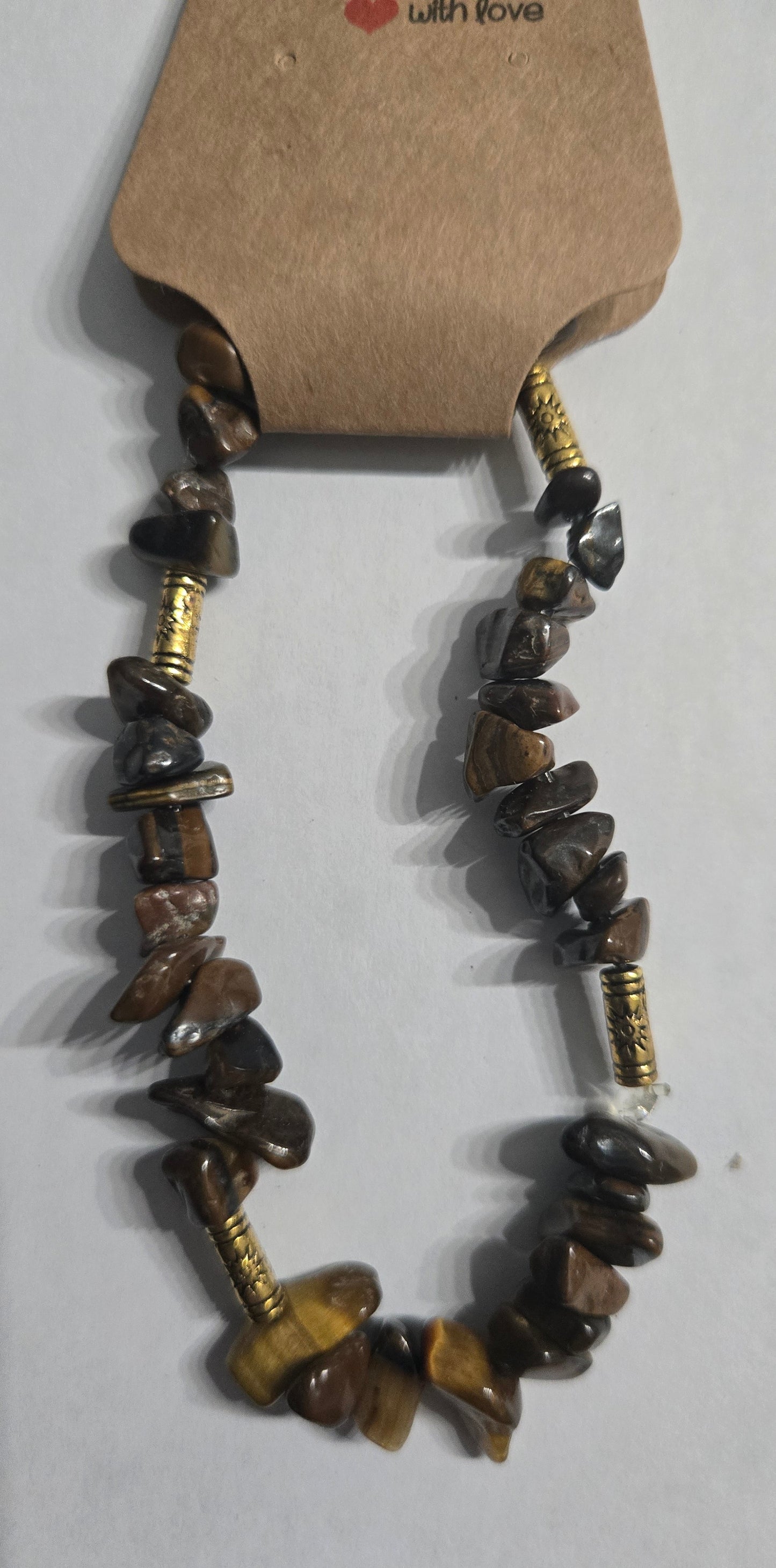 Genuine Tiger' Eye stone bracelet with gold in color metal spacer beads.