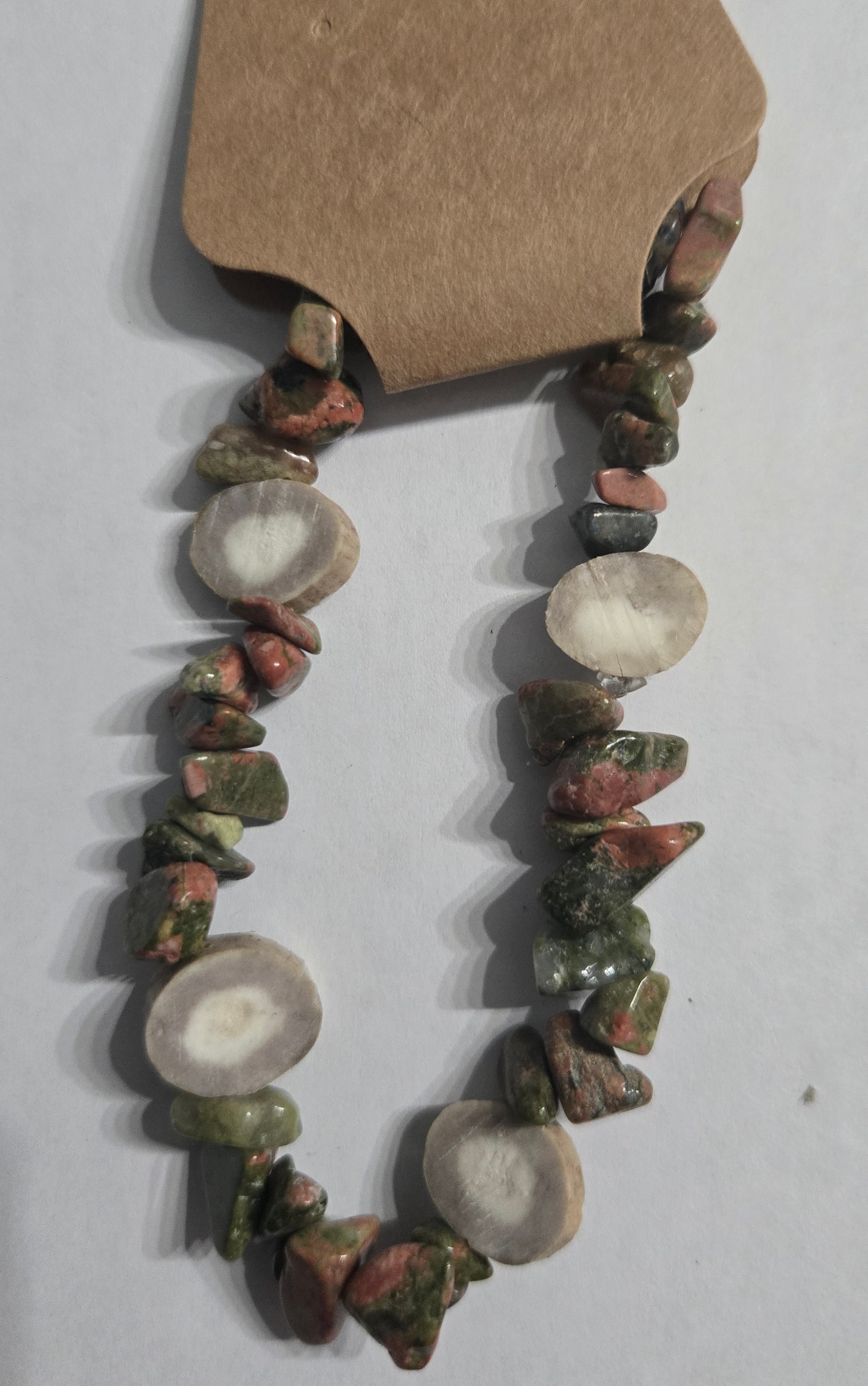 Multicolored gemstone bracelet with deer antler charm accents.