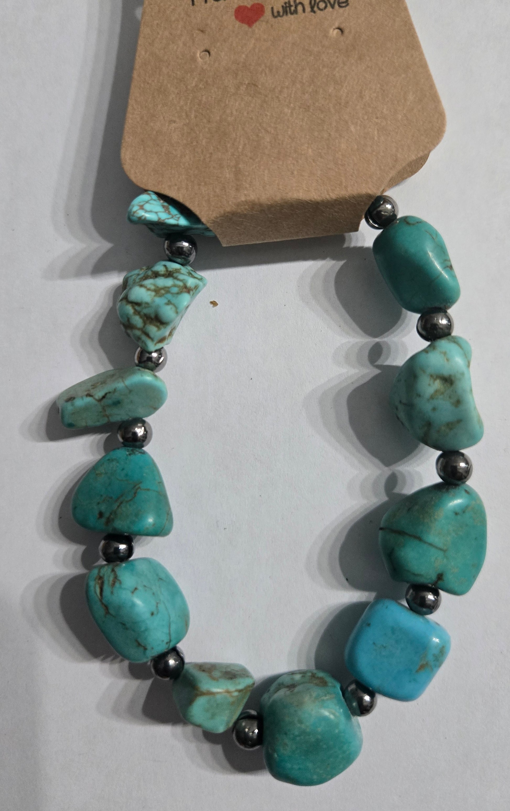 Turquoise beaded necklace with metal spacer beads.