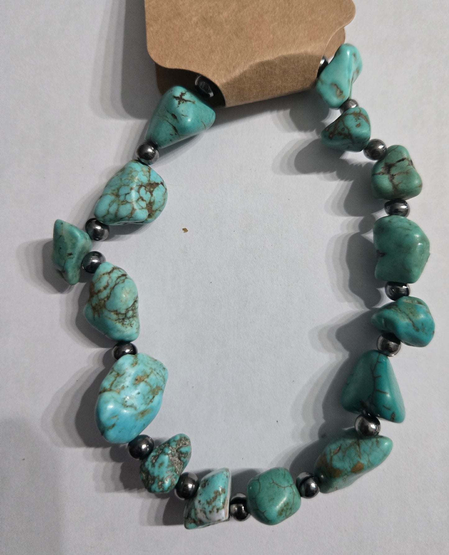 Turquoise beaded bracelet with metal spacer beads.