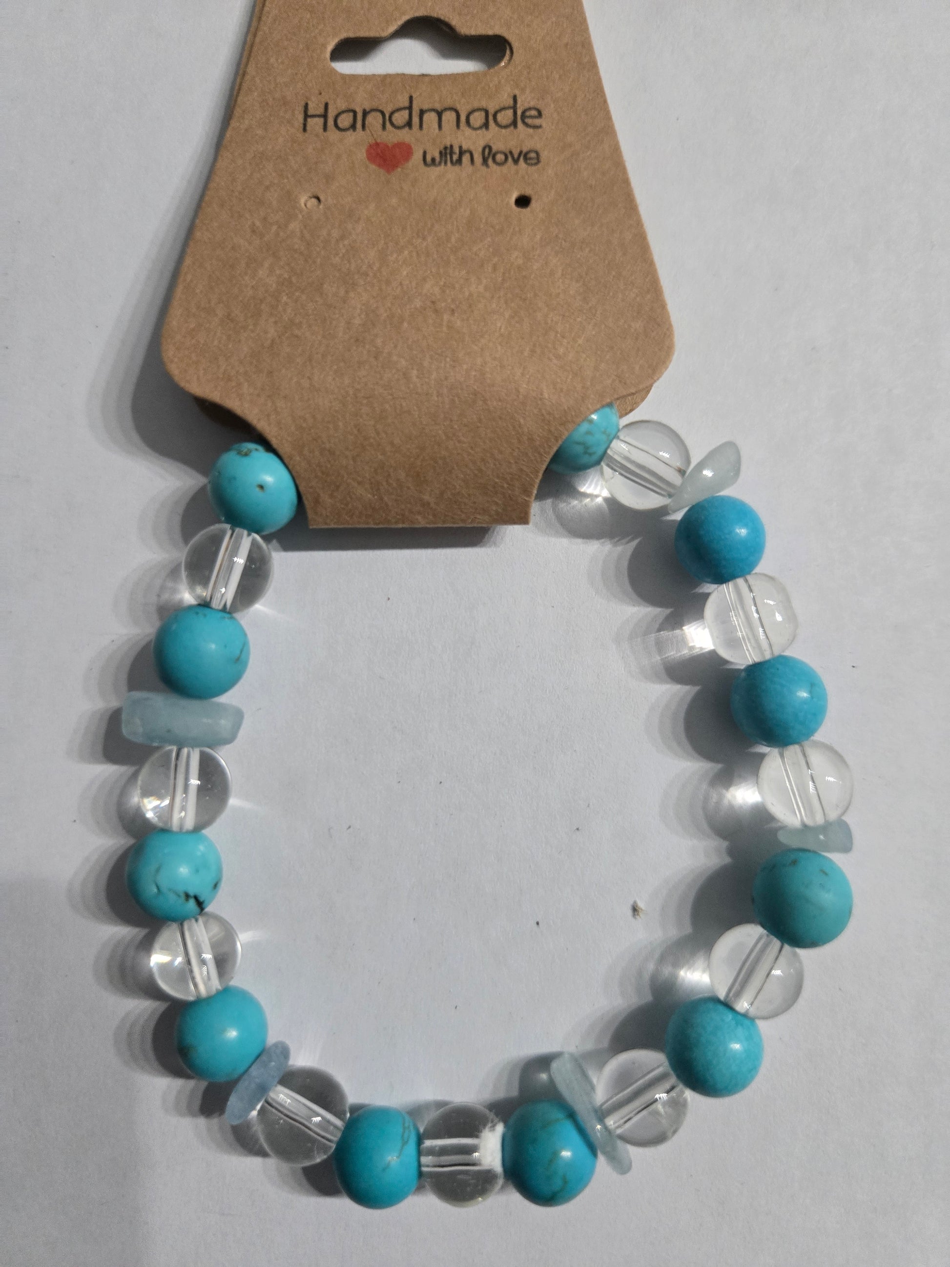 Beaded bracelet with turquoise and clear beads.