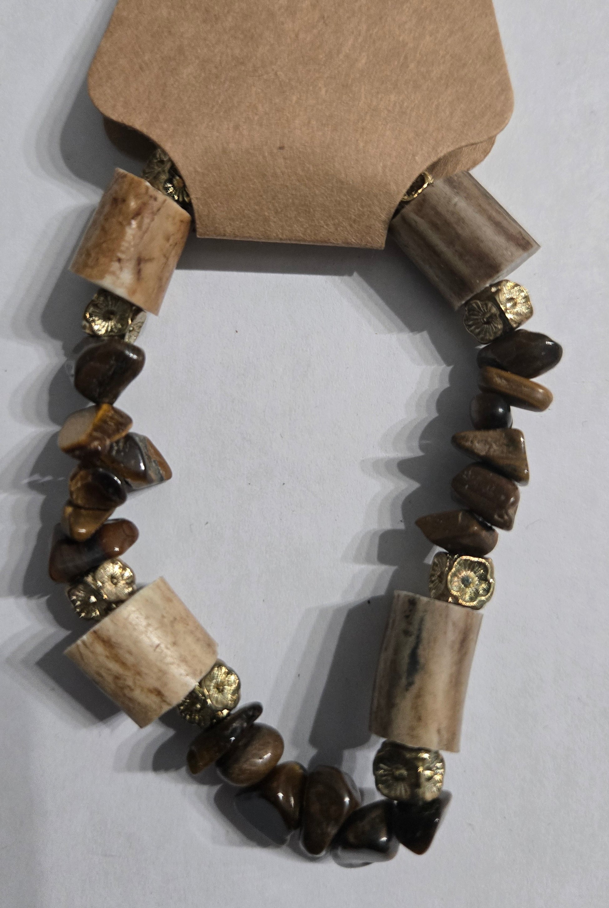 Bracelet with genuine Tiger's Eye stones, accented with gold in color spacer beads and deer antler charms.