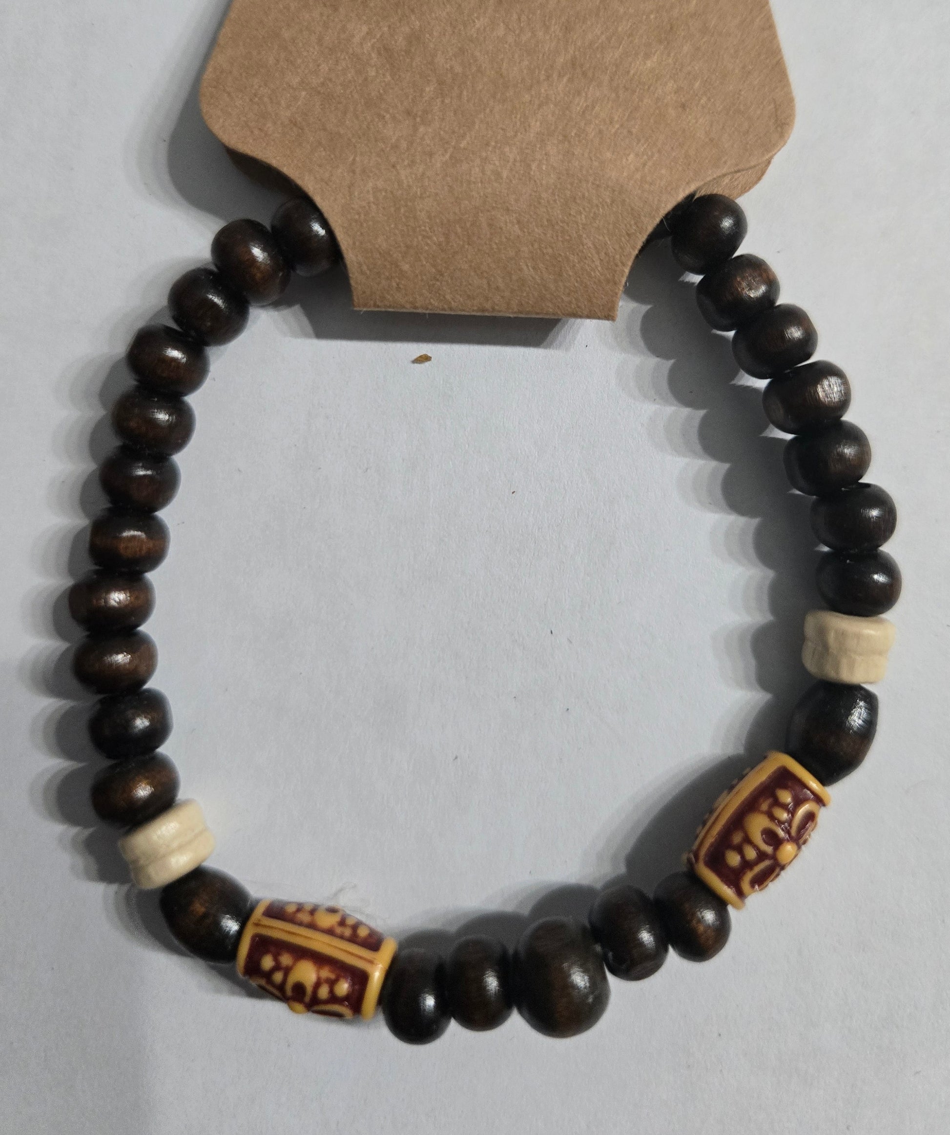 Wooden beaded bracelet with decorative wooden Aztek beads.