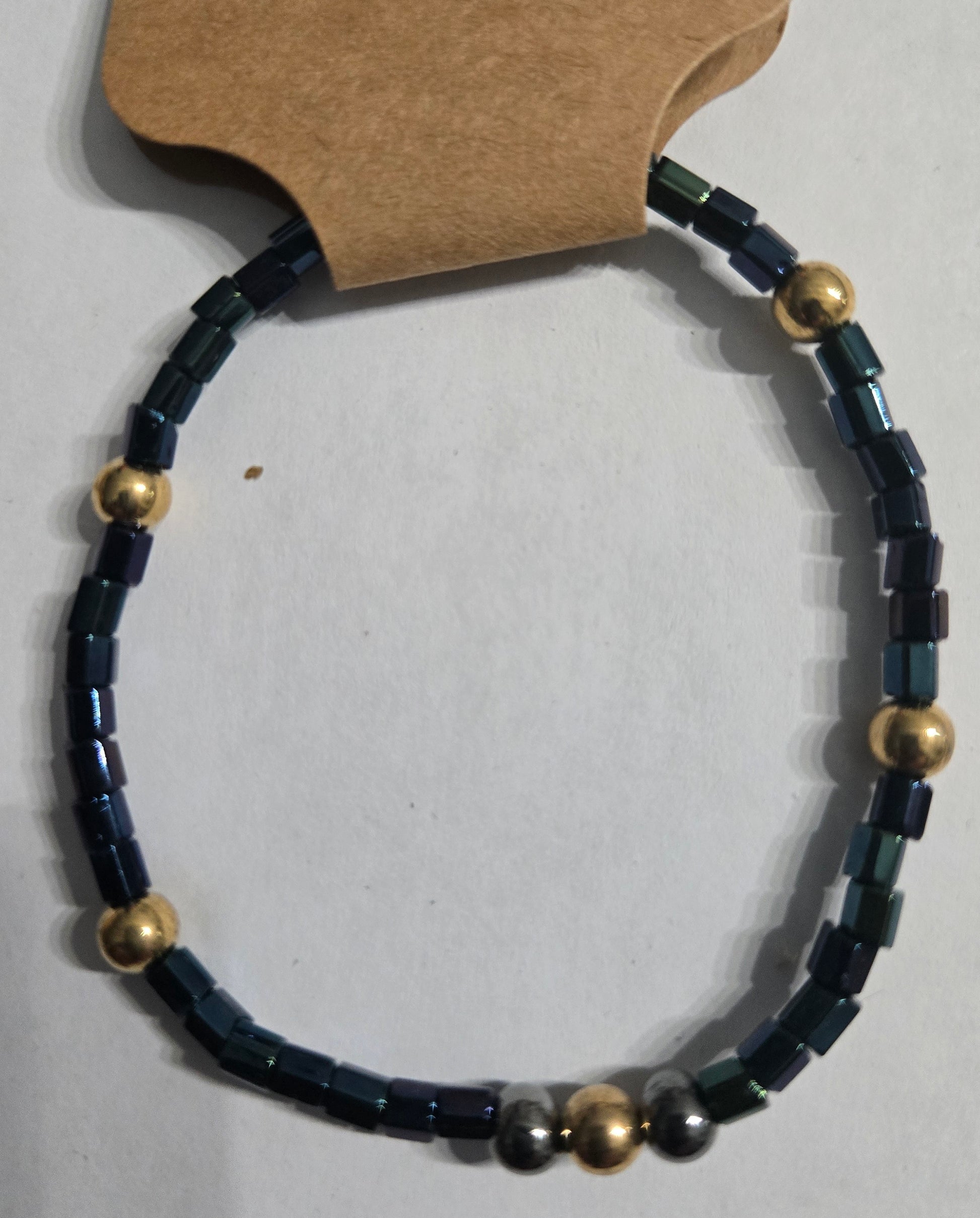 Bracelet with blue and gold beads.