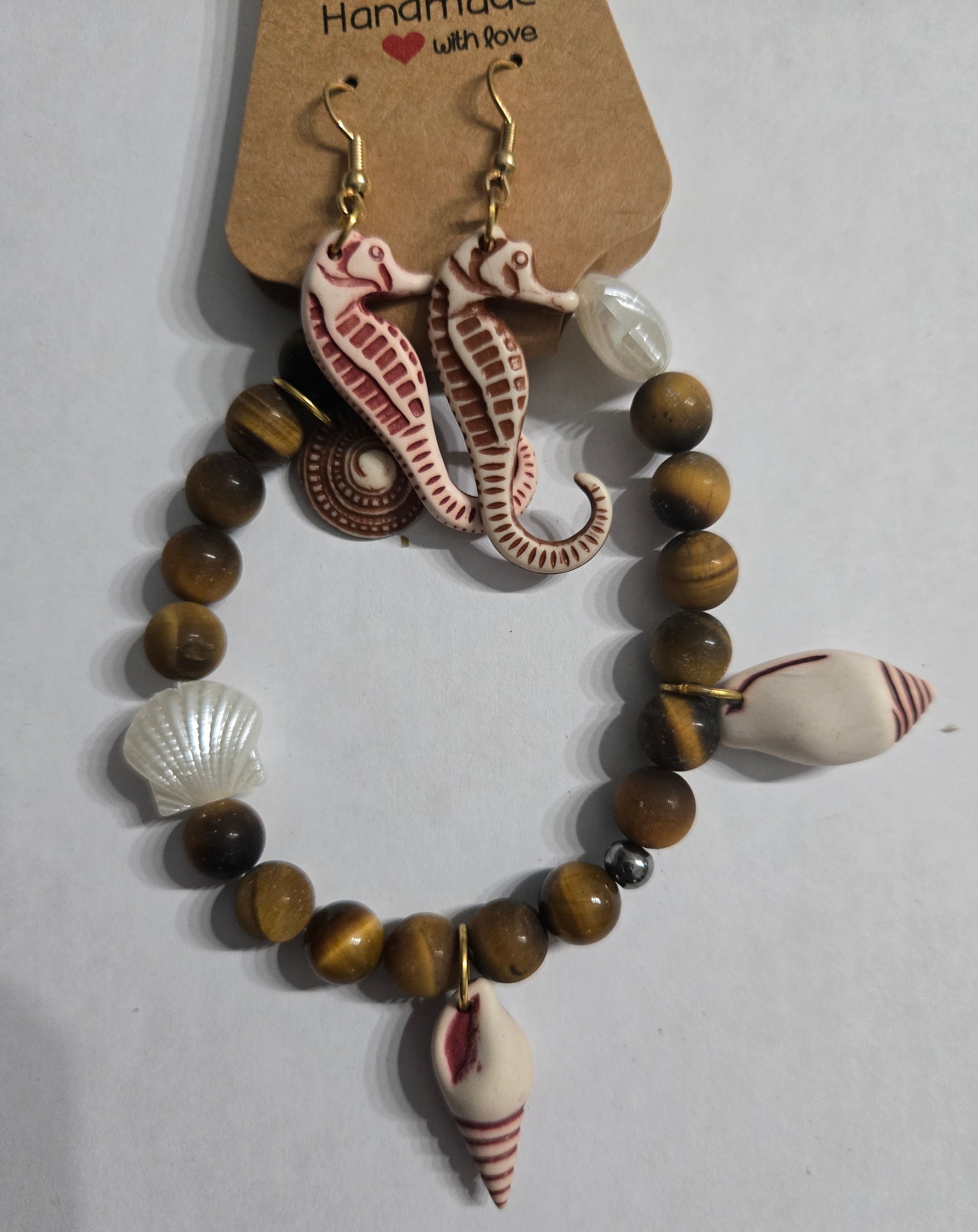 Bracelet with genuine Tiger's Eye beads, accented with seashell charms + seahorse earrings.