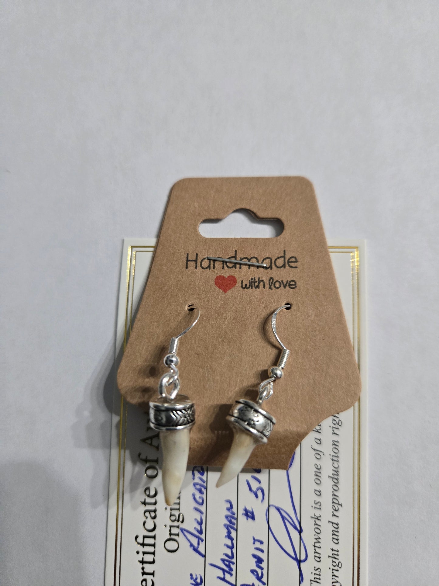 Genuine Alligator Teeth earrings on sterling silver earring facets.