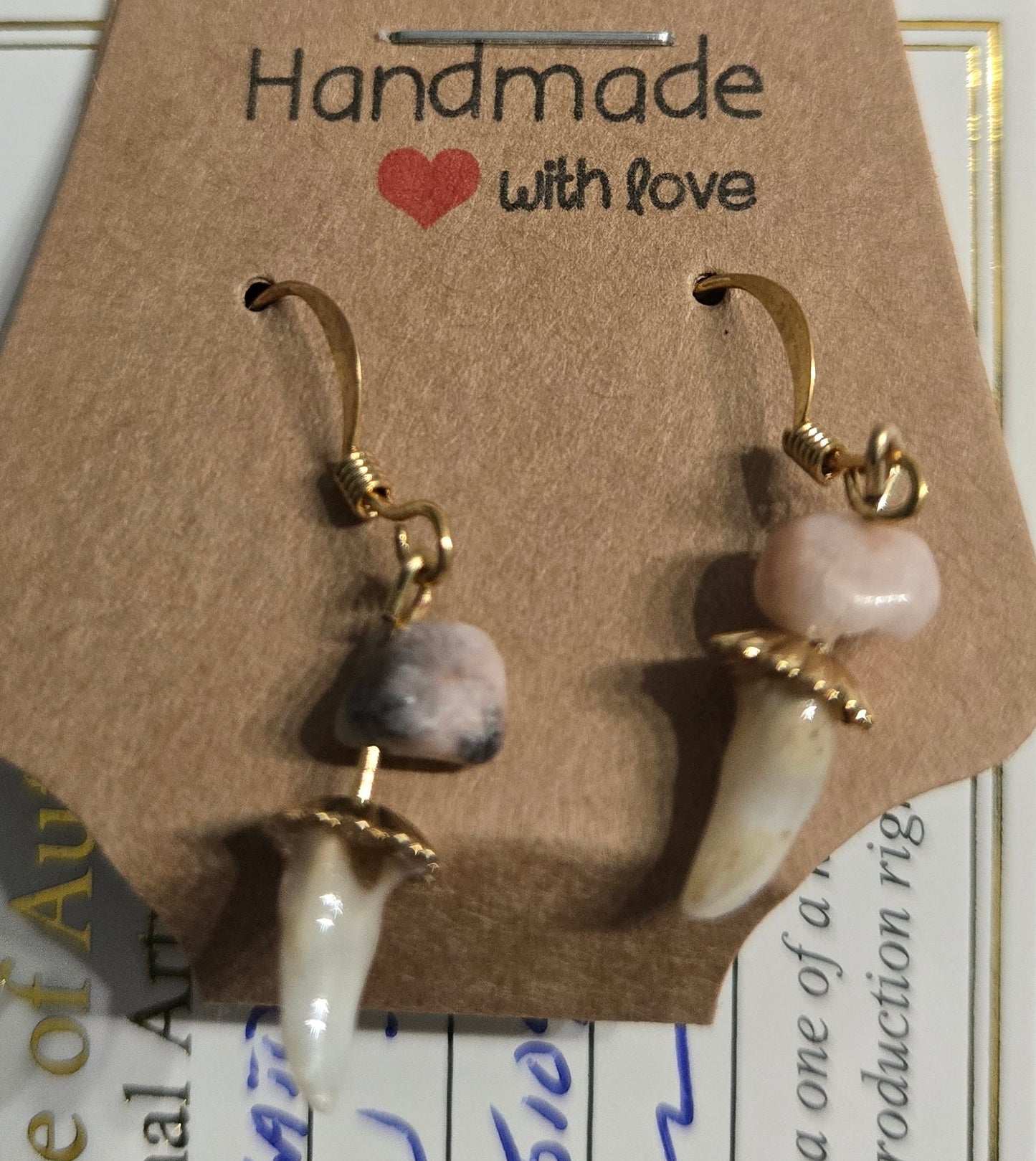 Genuine Alligator Teeth earrings on gold-plated earring facets, with rose quartz stone accents.