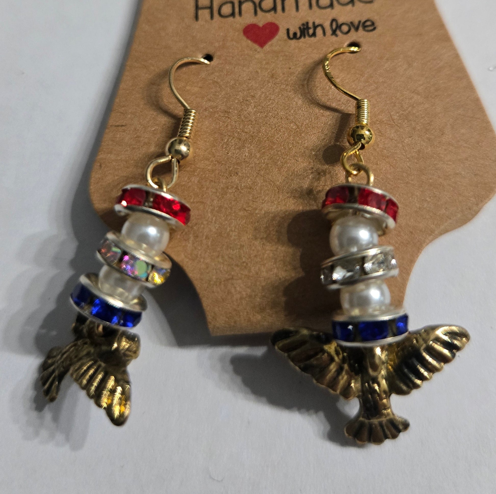 Gold plated earrings with patriotic eagle charms.