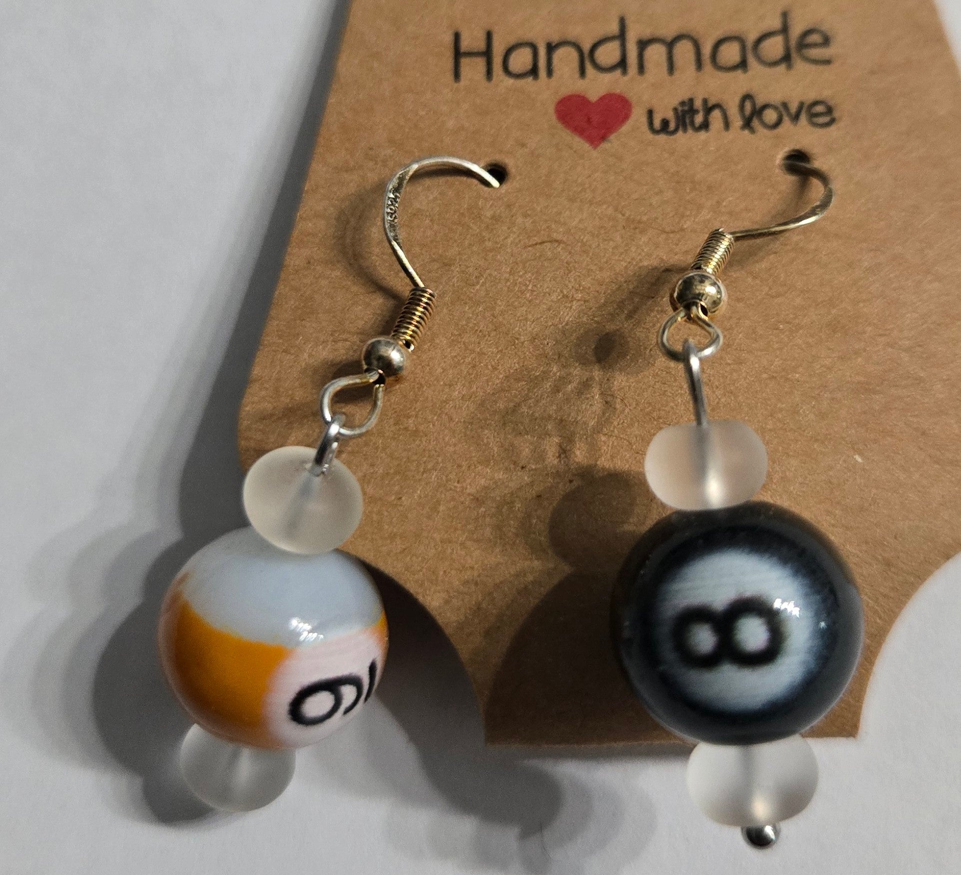 Sterling silver earrings with frosted bead accents, coupled with numbered pool ball charms.