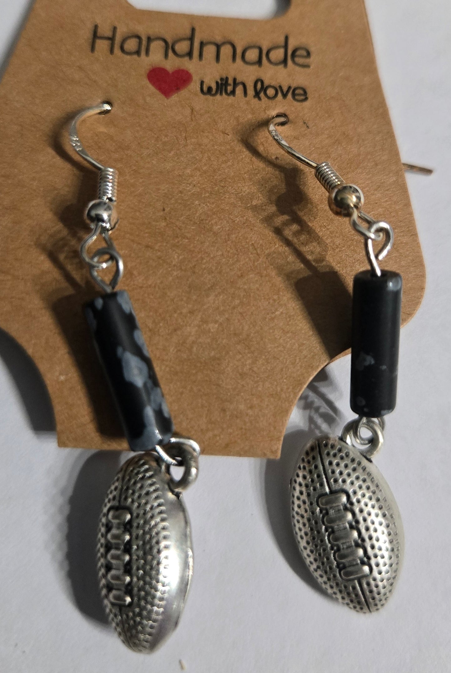 Sterling silver earrings with football charms.
