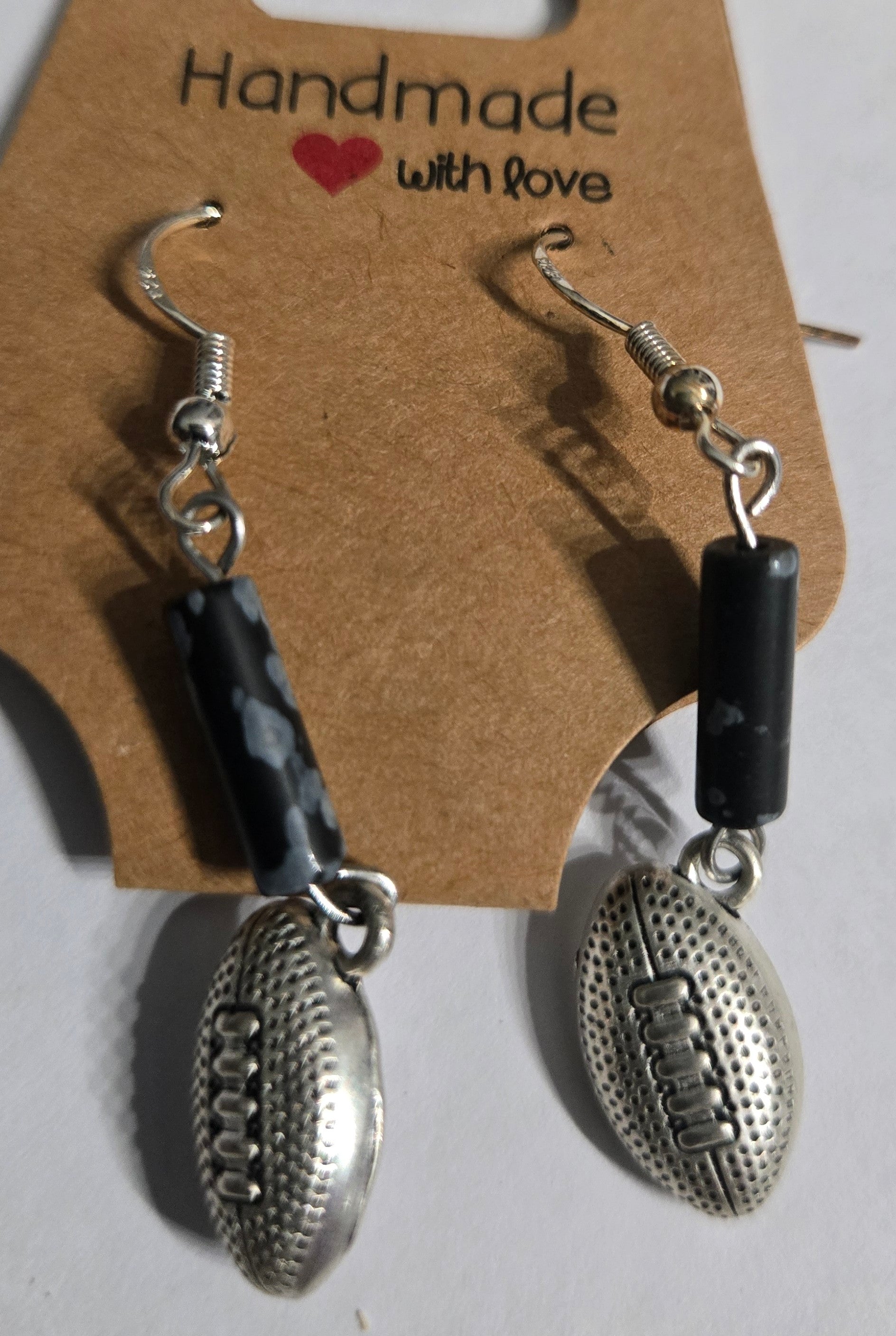 Sterling silver earrings with football charms.