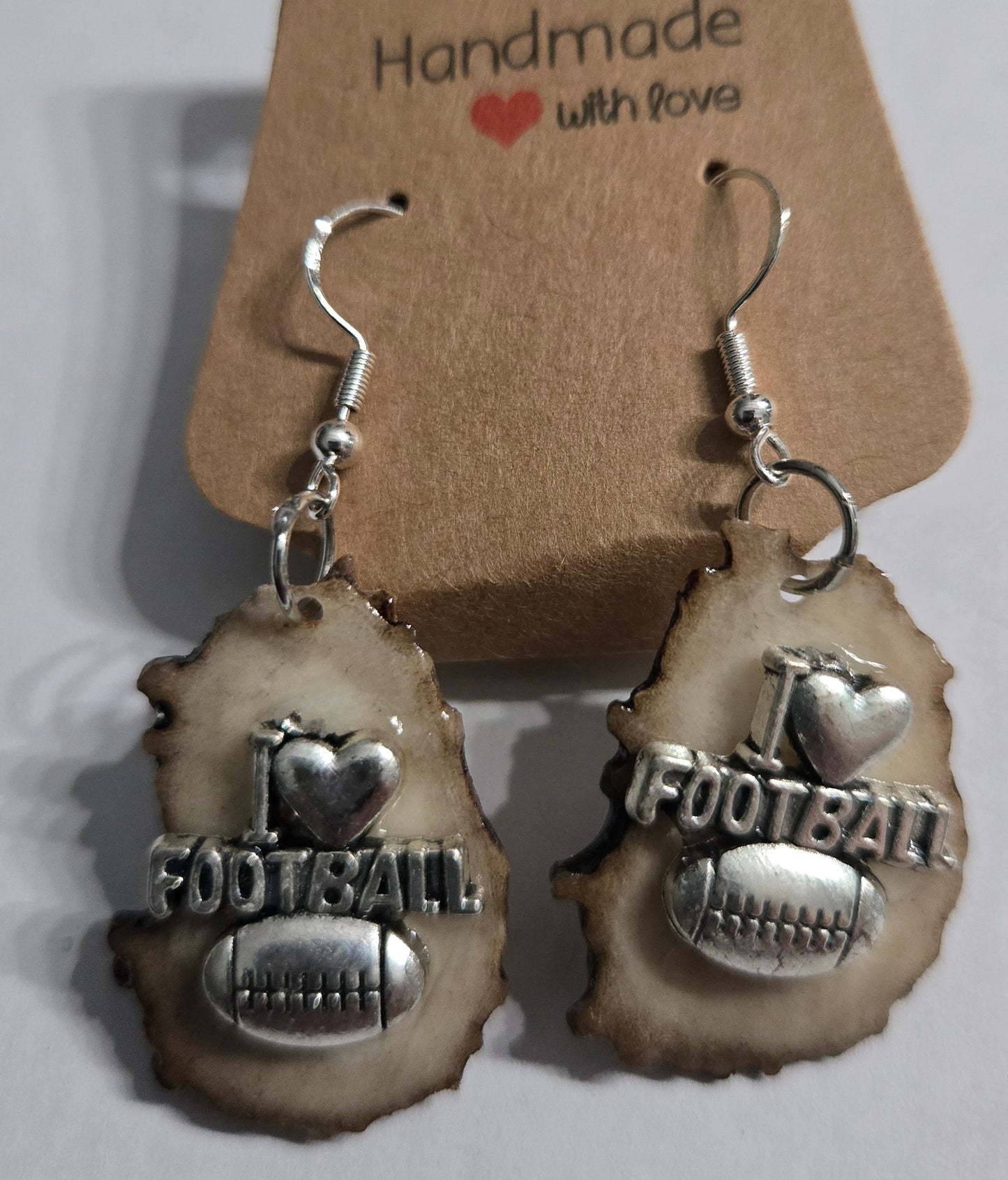 Sterling silver earrings with deer antler football charms.