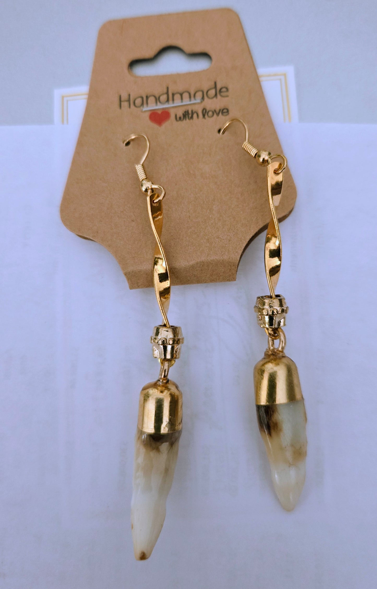 Gold-plated dangling earrings with Genuine Alligator Teeth with gold colored accent beads.