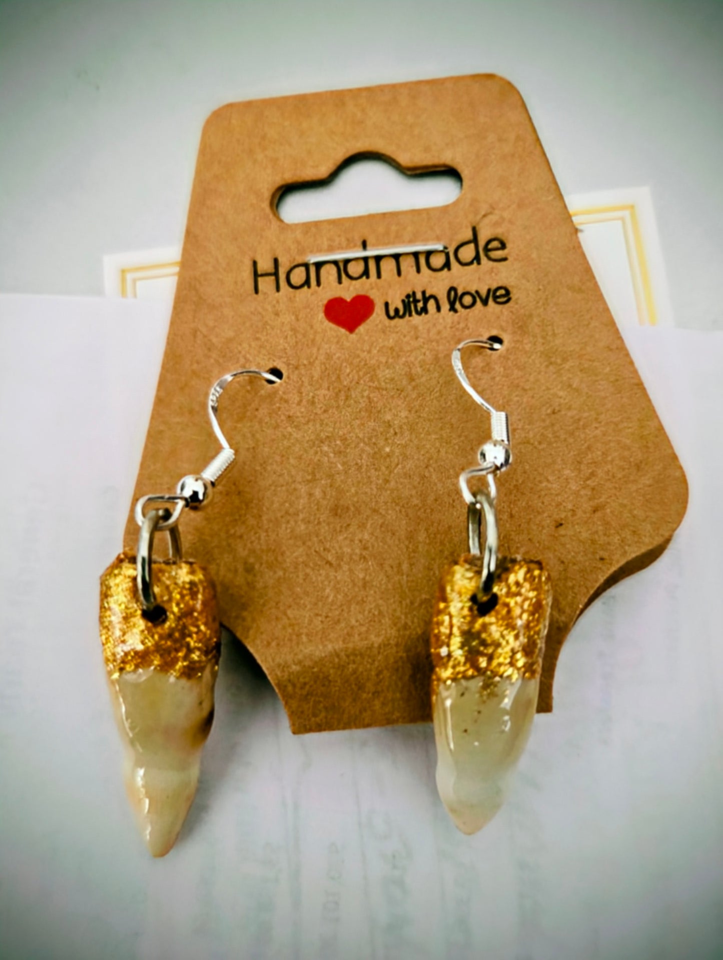 Genuine Alligator Teeth earrings on sterling silver earring facets.