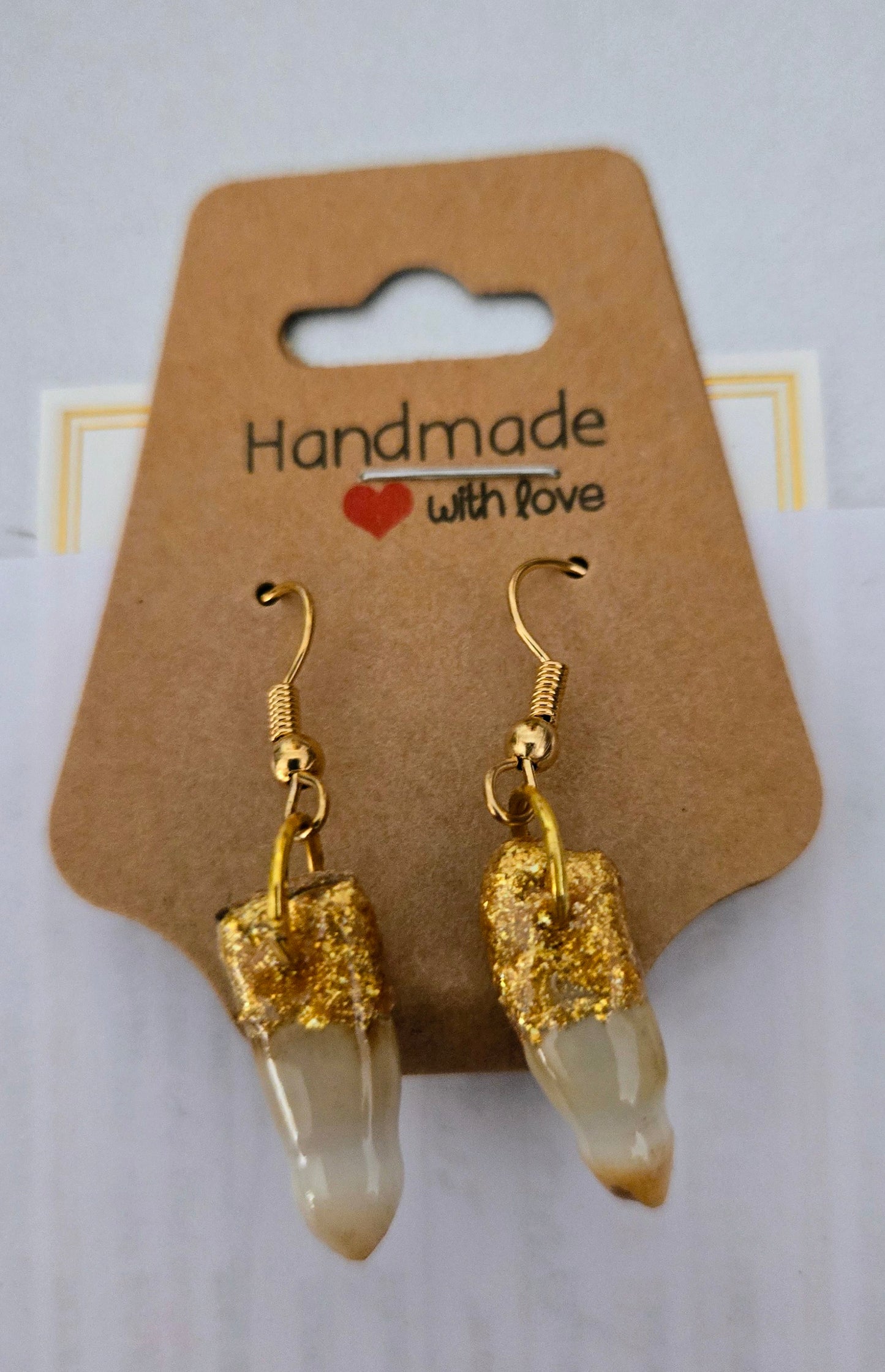 Genuine Alligator Teeth earrings mounted on gold-plated earring facets.